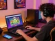 Engaging gaming experience on oppa86 situs featuring a user with gaming gear.